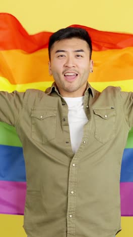 Man holding rainbow flag