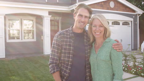 Couple-Outside-Home-With-For-Sale-Sign-Shot-On-R3D