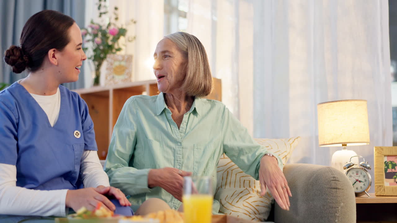 Caregiver assisting senior woman at home