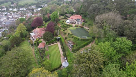 large houses in beer fishing village a devon england uk drone aerial view