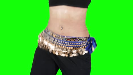 unknown woman doing belly dances in the studio
