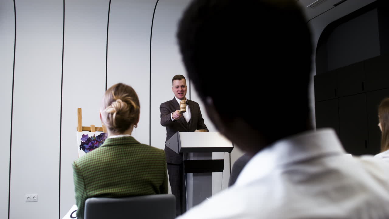 Man in elegant suit with gavel