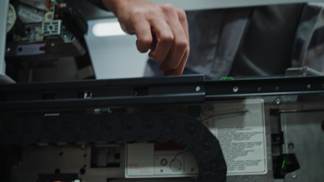 Technician Working on Industrial Printer/Scanner