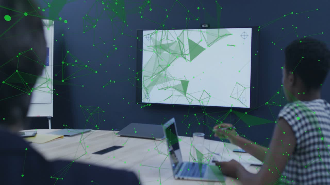 Businesswoman leaning in at table, tapping trackpad and analyzing technology network overlay