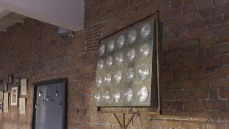 industrial style light fixture on brick wall