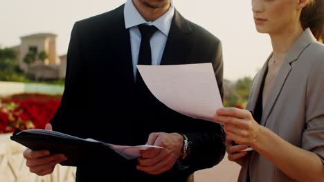 business people discussing documents