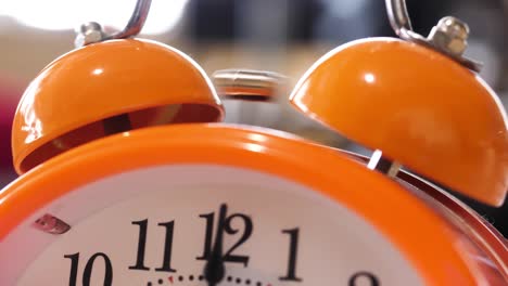 orange alarm clock close up