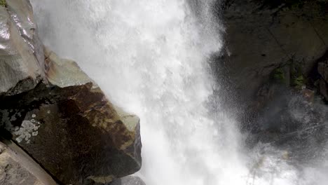 splashing water from nooksack falls and rocky mountain landscape of mt