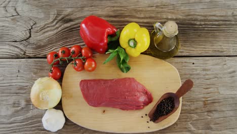 Sirloin-meat-loaf-and-ingredients-on-wooden-board