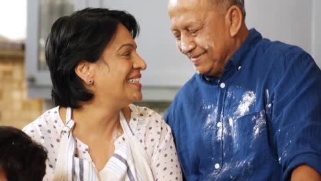 Senior-couple-looking-at-each-other-in-kitchen-4k