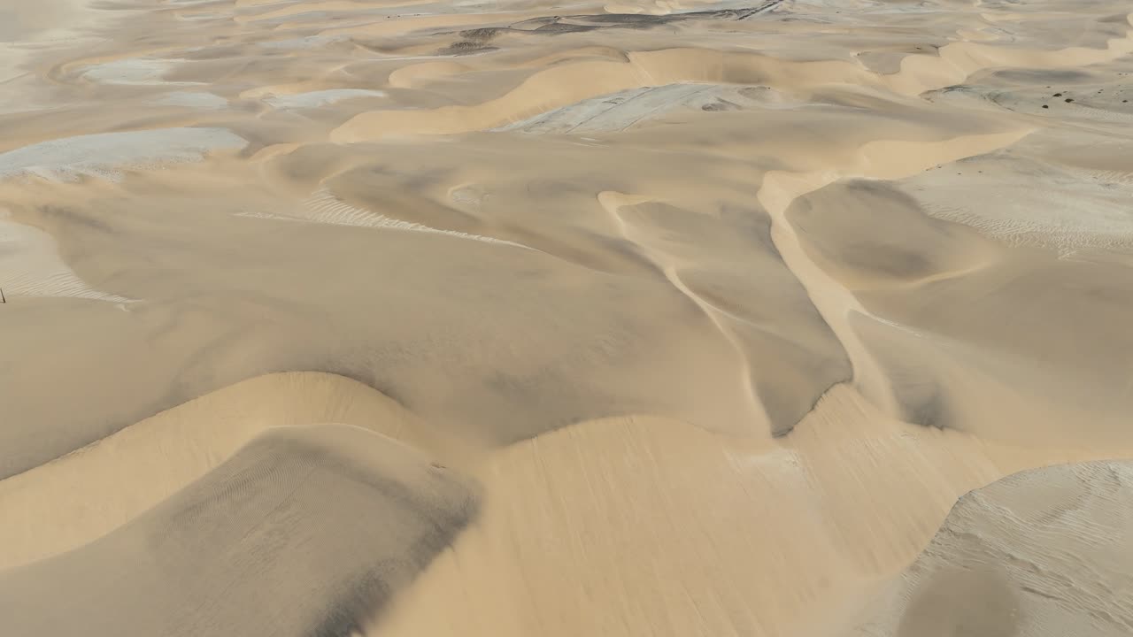 drone footage of rolling desert dunes around Swakopmund, Namibia