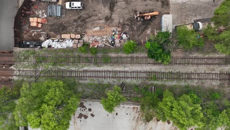 top down shot of abandoned railroad tracks outside of usa city