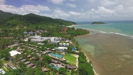 aerial view descending to tropical koh chang island paradise vacation coastline resort