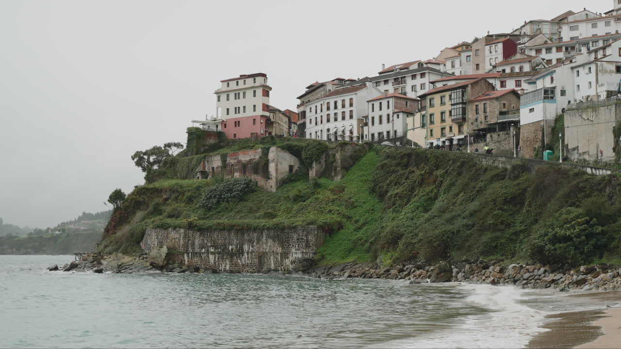 Coastal Town with Cliffside Houses and Sea View