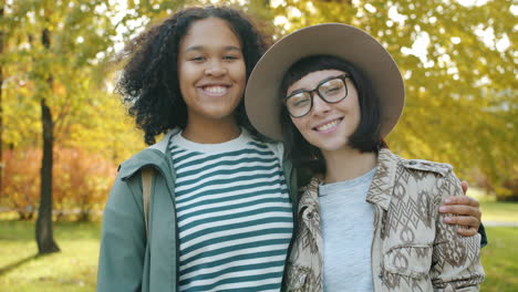 two happy women in autumn park