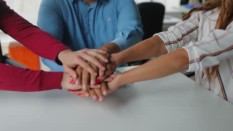 close up shot of team members hands.