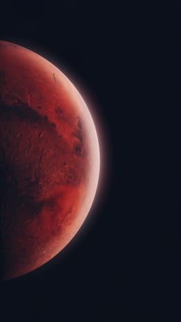 vertical video panning across void of space to red planet mars with bright thin atmosphere and details of surface including craters and mountains. add to science social media videos.