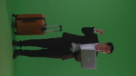 businessman excited with laptop and suitcase