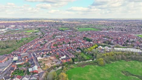 a cinematic shot above the homes, cottages, and warehouses of leicester, uk