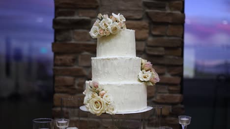 3-Tier-Floral-Wedding-Cake-on-Display-at-Wedding-Reception---Approach-Shot