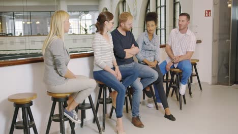 colleagues having chat during break