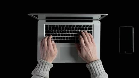 a man working on a laptop online from his home