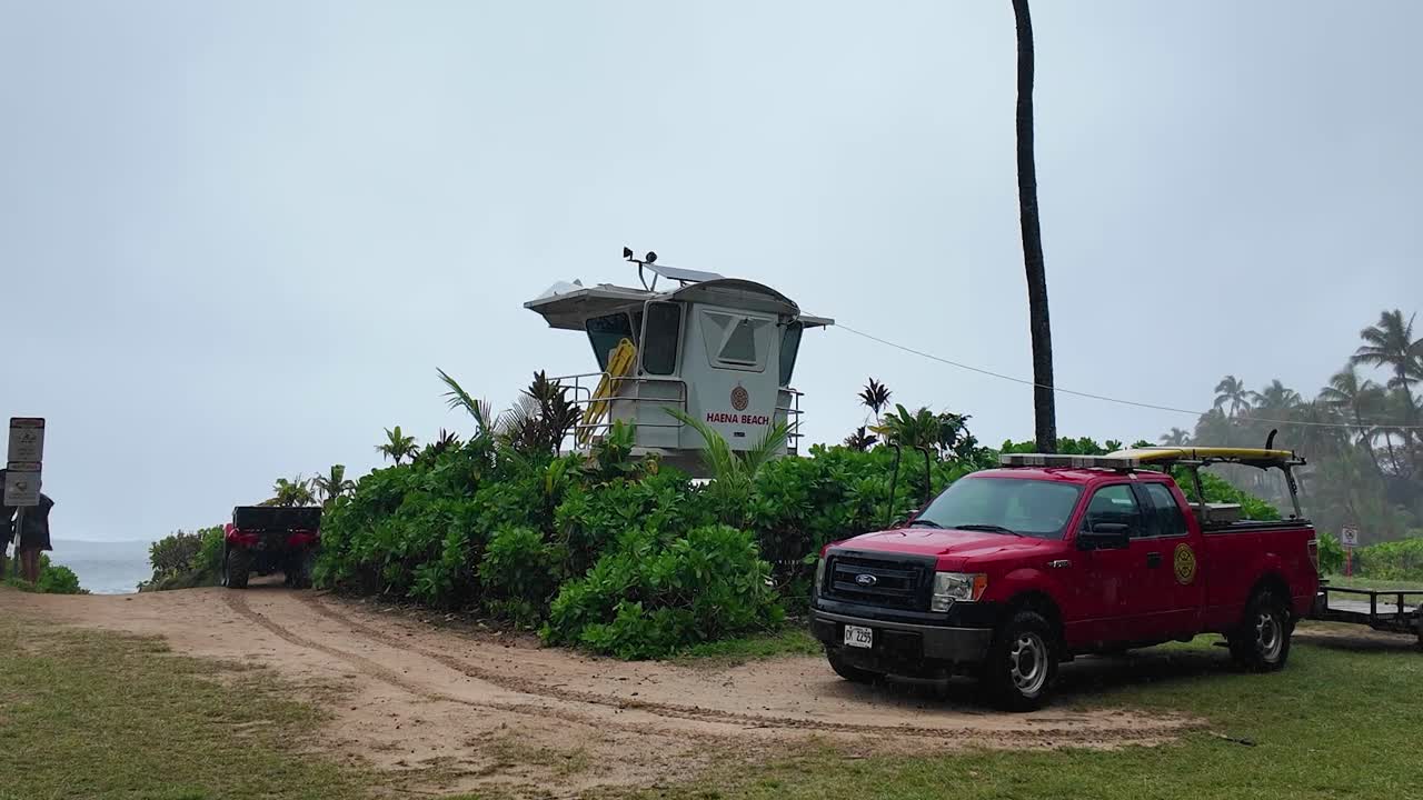Lifeguard tower at Haena Beach Park, Kauai US, a beautiful sandy Haena Beach at Haena Beach Park on North Shore of Kauai, Hawaii on a cloudy foggy day, popular snorkeling spot, Na Pali Coastal line