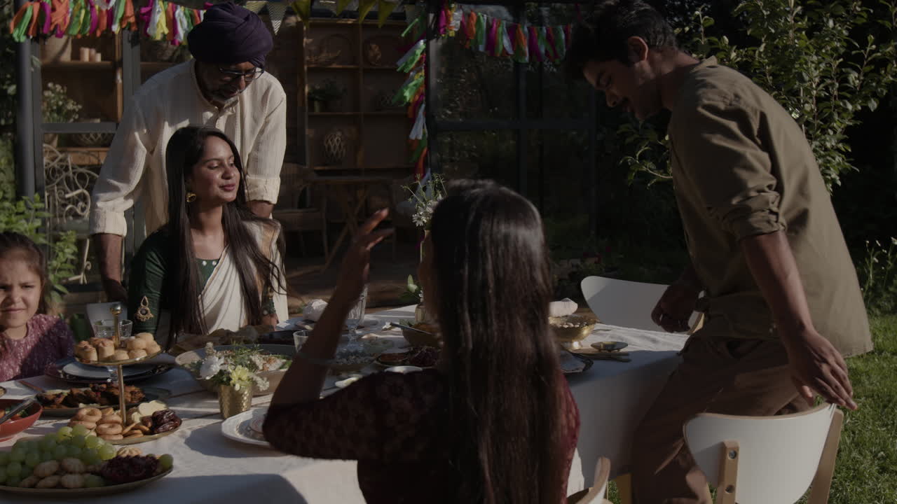 Indian Family Enjoying a Festive Outdoor Meal