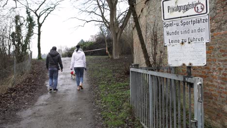 people walking on a path near a private playground in germany