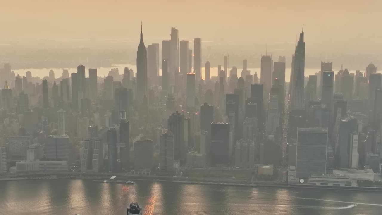 Beautiful aerial view of New York City under a hazy sunset sky
