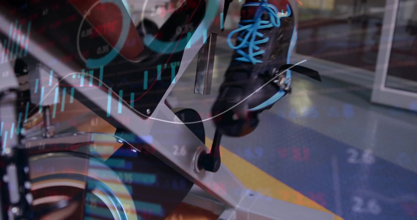 Fitness enthusiast man placing feet on pedal and generating animated financial charts in gym studio