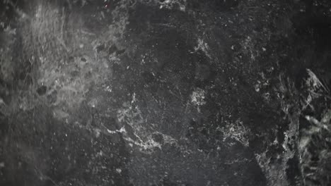 mármol negro giratorio con textura de fondo de vetas grises