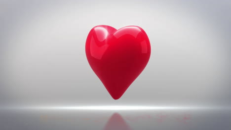 animación del icono de corazón rojo girando contra el espacio de copia en un fondo de gradiente gris.