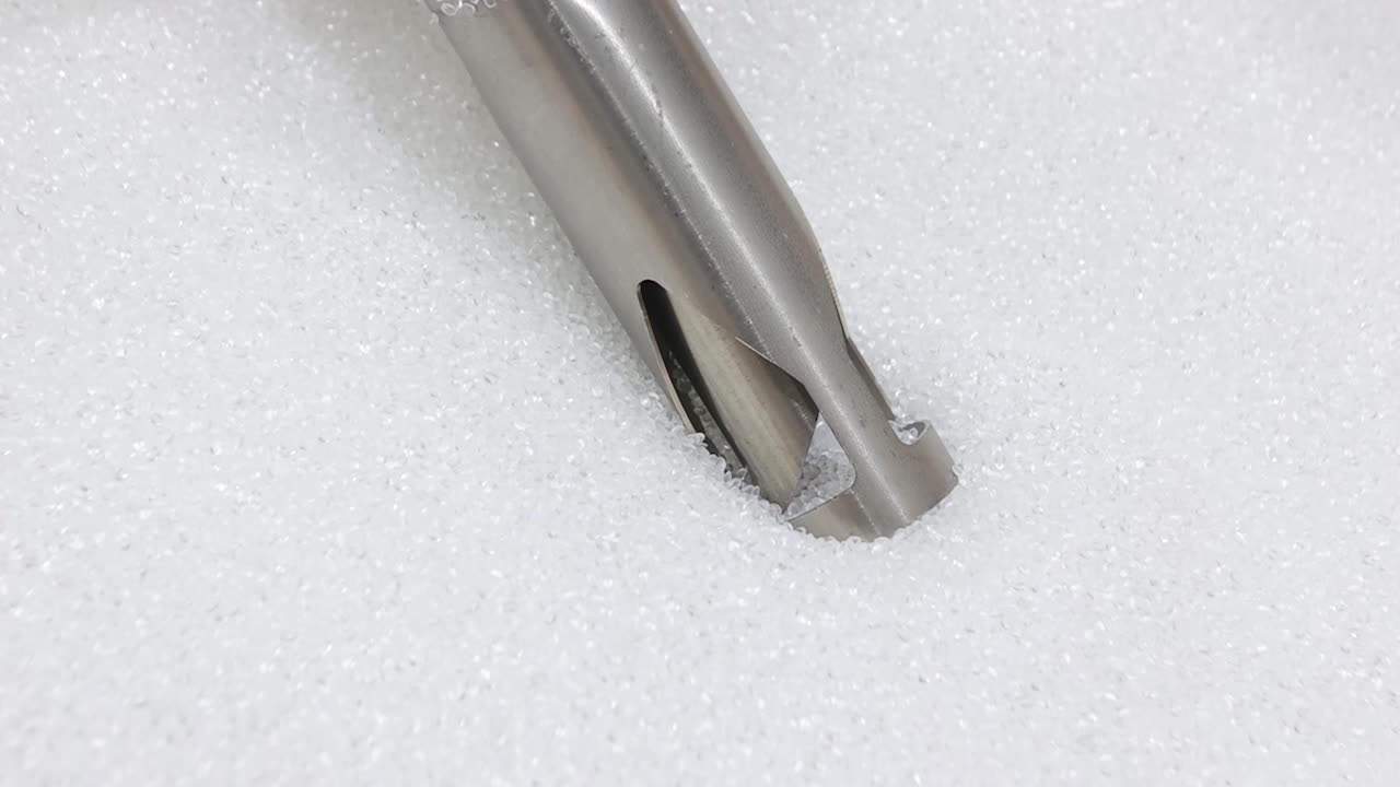 Close view of plastic grains automatically pulled for EVA films