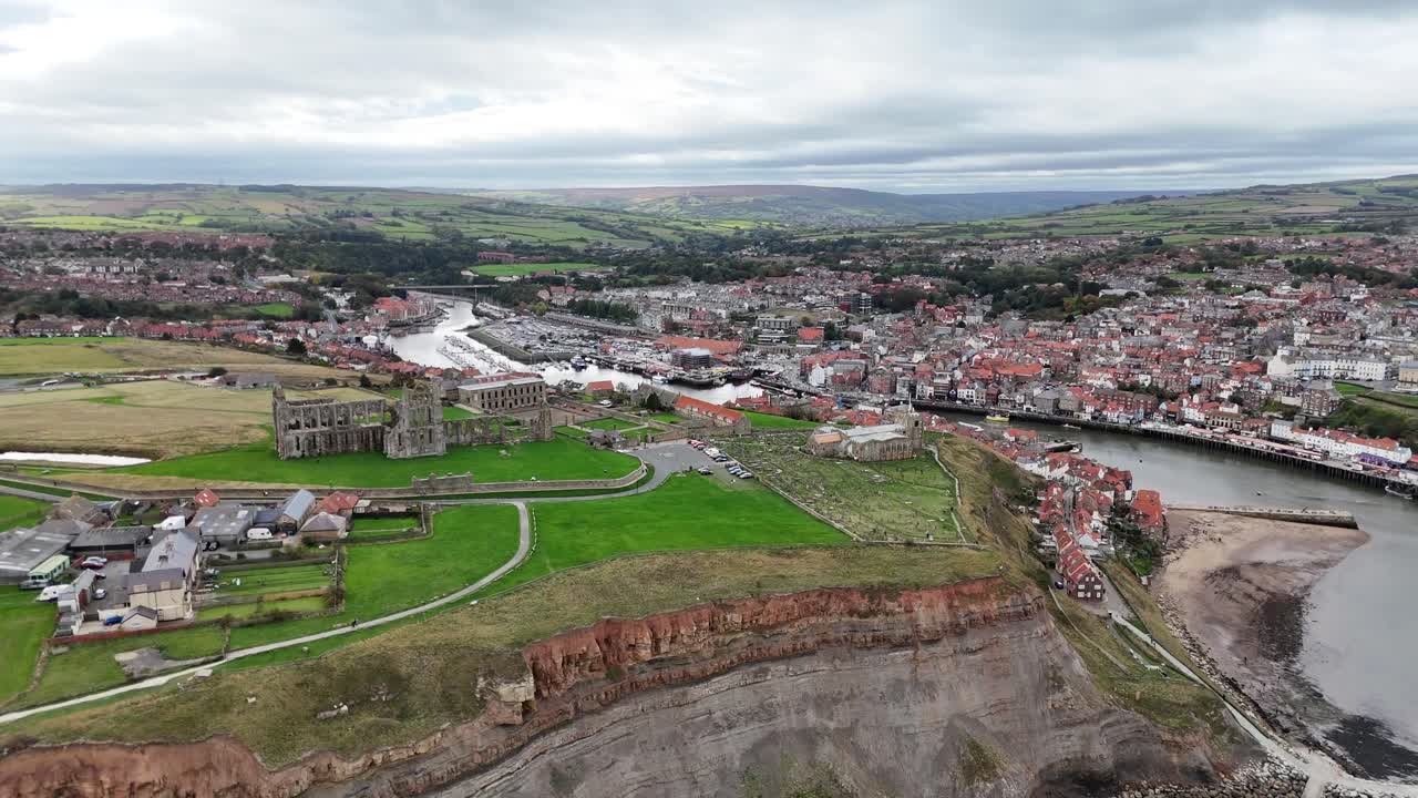 Aerial drone view Whitby Abbey north yorkshire british english seaside port harbour town city england uk