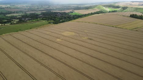 Combe-hill-intricate-crop-circle-aerial-view-towards-idyllic-Wiltshire-wheat-field-spiral-pattern