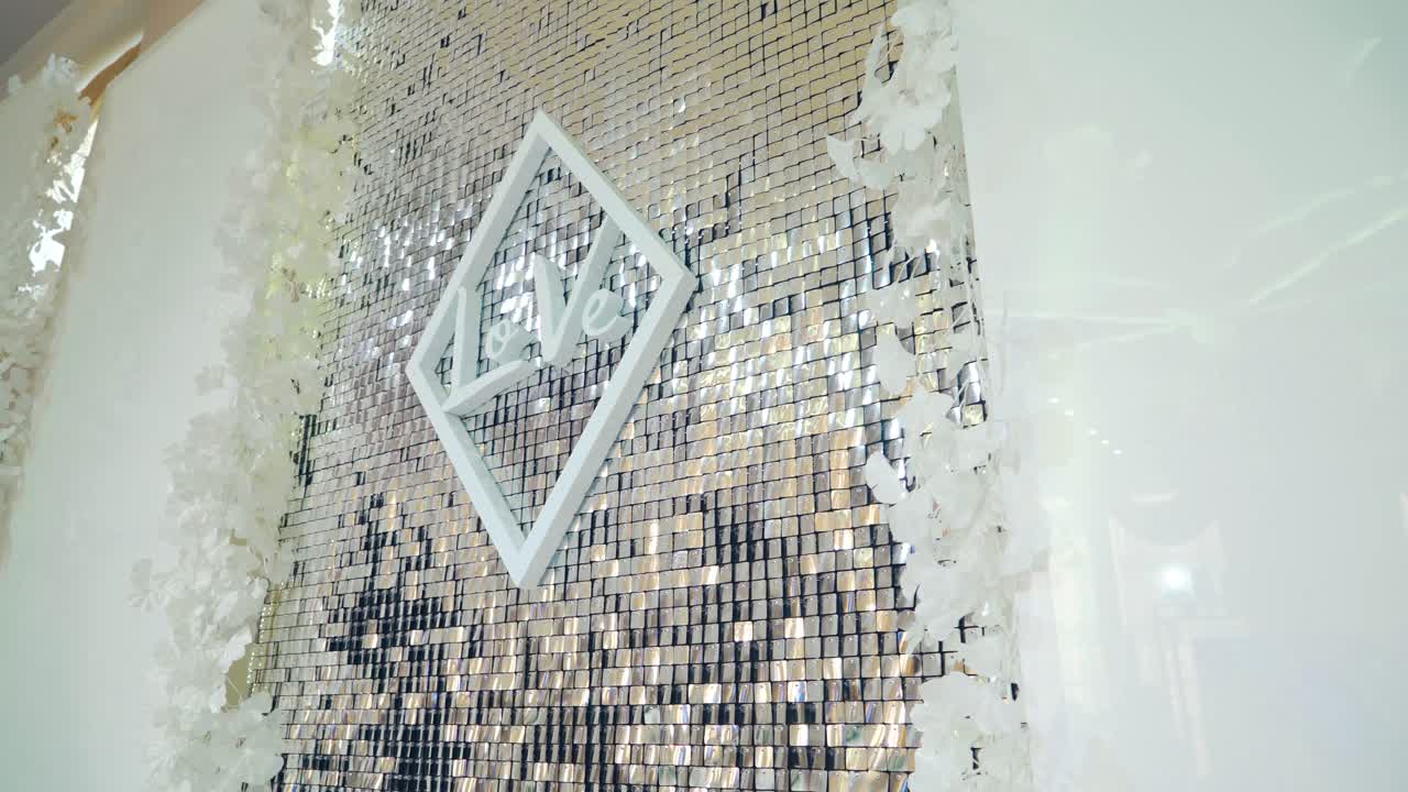 Golden mosaic background. Close up view of glittering sequins wall at backgroung