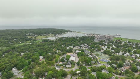 wide drone shot approaching a seaside town in cape cod, massachusetts