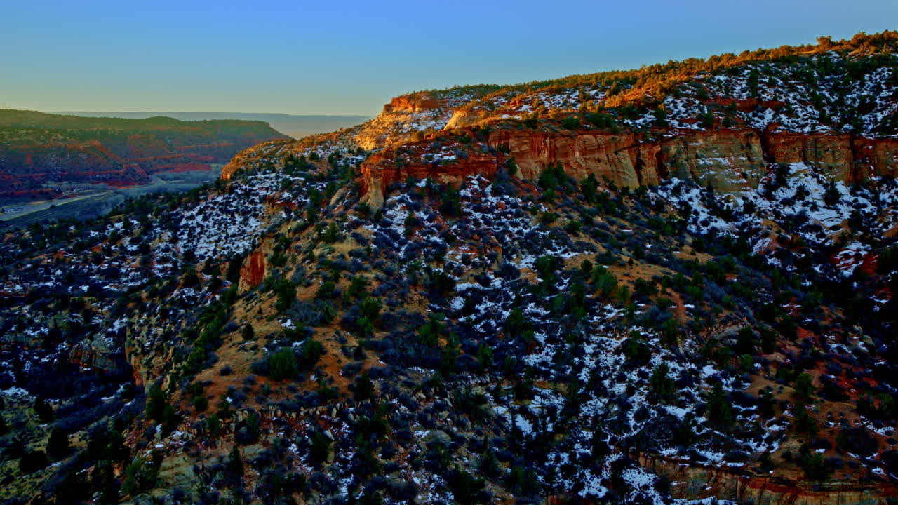 Aerial footage capturing the dramatic colors and shapes of the toadstool hoodoos landscape.