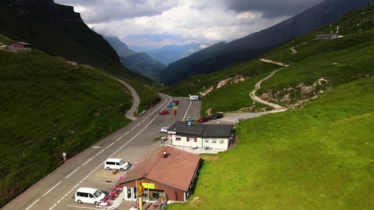 Aerial shot flying low over summit of Klausenpass in Uri and Glarus, Switzerland