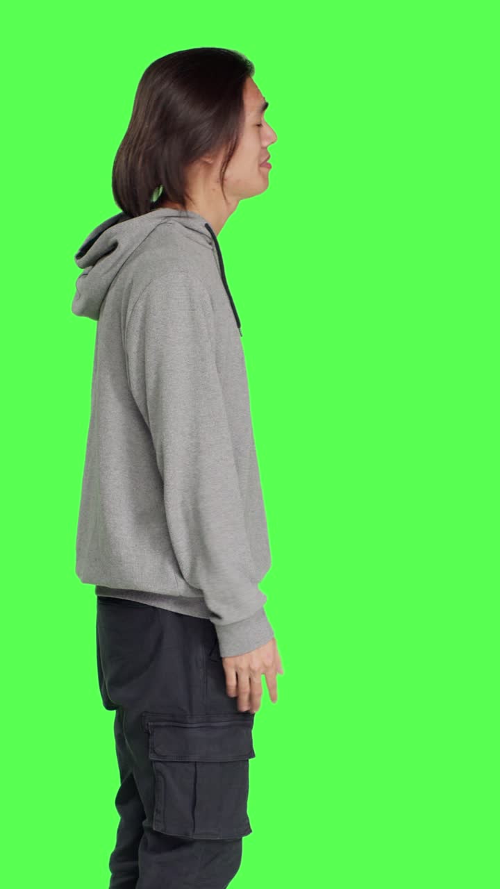 Profile of uncertain adult shrugging on camera