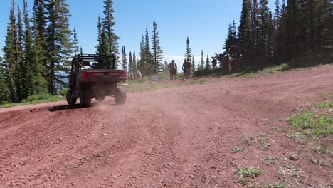 Off-road-vehicle-driving-away-on-a-mountain-road