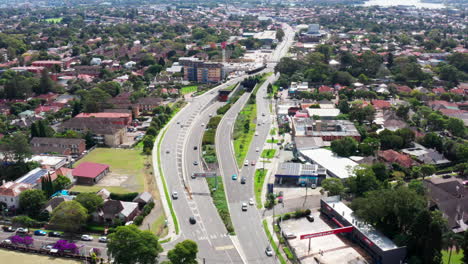 Aerial-drone-shot-flying-over-the-parramatta-road-and-the-entry-to-the-m4-westconnex-tunnel-in-Sydney-Australia