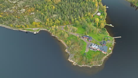 above view of a swedish peninsula with autumnal forests in sweden