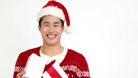 festive man holding christmas gift