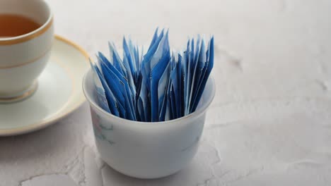 Spoon-of-white-sweetener-on-a-black-background