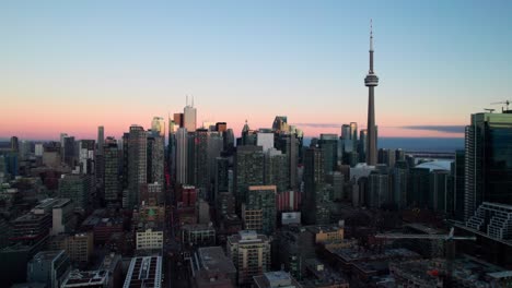 Toronto-at-dusk,-4K-drone-shot-of-downtown-skyline