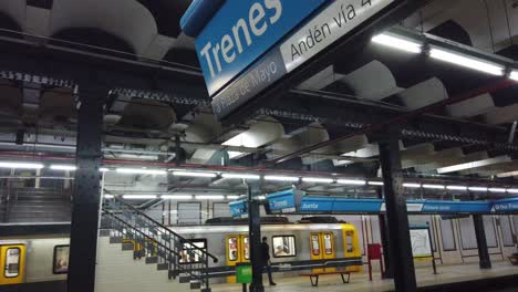 train arrives at vintage underground station of buenos aires south american city