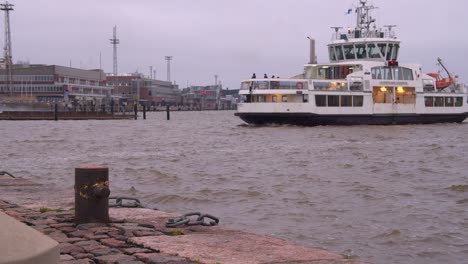 tourism ferry returns to helsinki harbour from historic suomenlinna