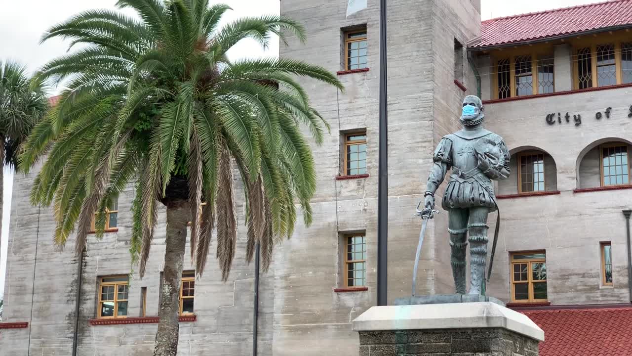 Conquistador Statue Wearing a Face Mask in Front of Lightner Museum, St. Augustine, Florida